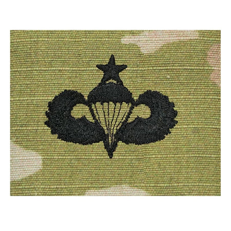 Black military emblem with star and parachute on a white background