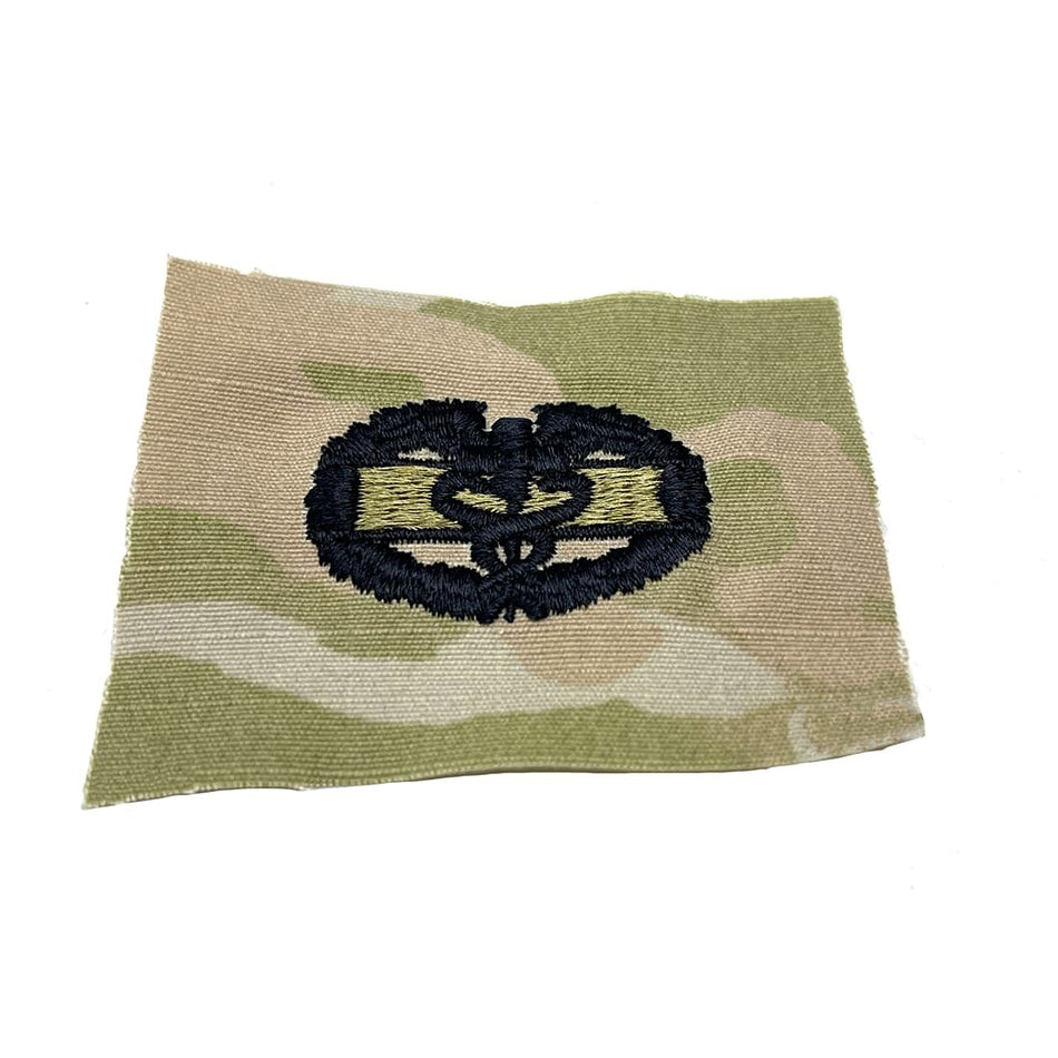 Army Combat Medic patch with a black emblem on a white background