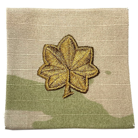 MAJ Major Army Rank Sew-On OCP Patch in gold thread, centered on a square fabric swatch with a beige and olive green camouflage pattern.