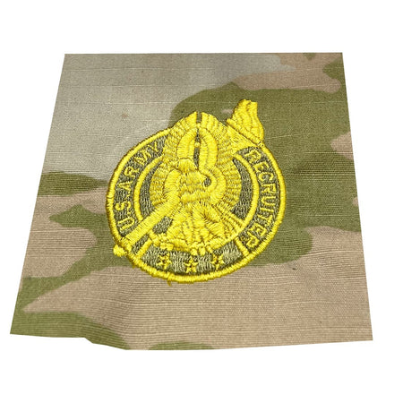 Senior Army Recruiter Badge Gold embroidered on a camouflage background