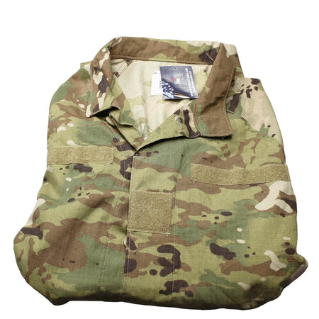 A folded military-style camouflage uniform shirt with a collar, button placket, and front utility pockets, shown on a plain white background.