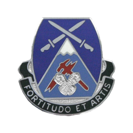 A military unit lapel pin featuring a blue and light blue shield with crossed silver swords, a mountain, and a red and silver emblem, with a black scroll reading 'FORTITUDO ET ARTIS' on a white background.