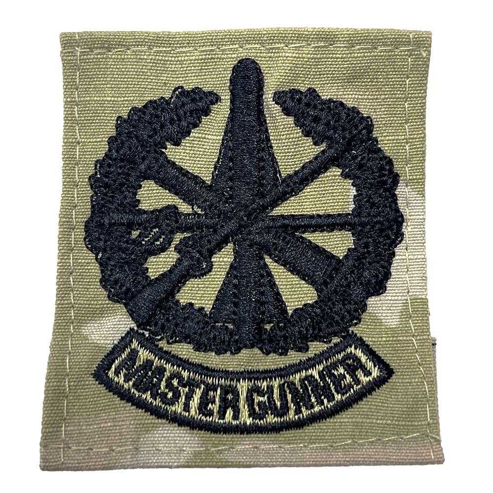 Patch with a wheel design and 'Master Gunner' text on a green background