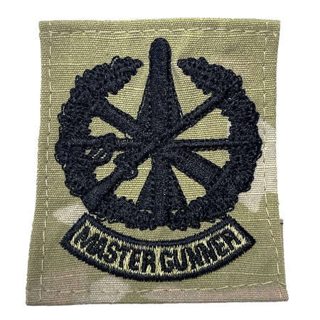 Patch with a wheel design and 'Master Gunner' text on a green background