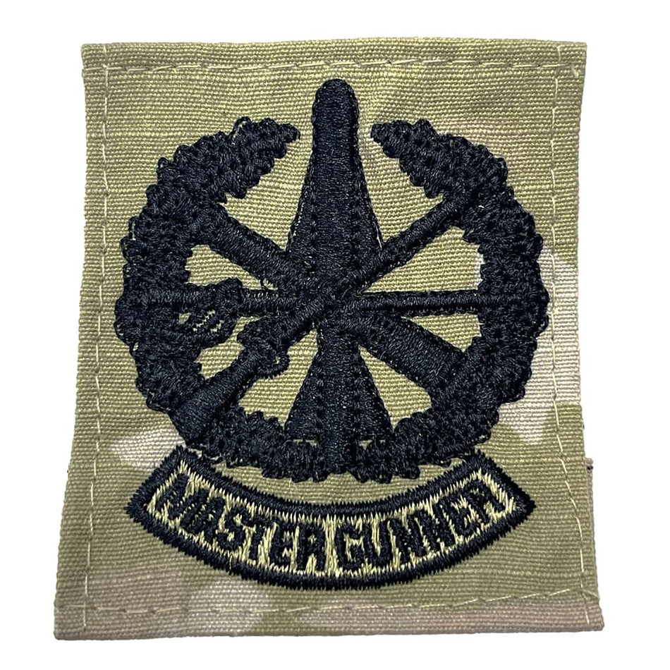 Patch with a wheel design and 'Master Gunner' text on a green background