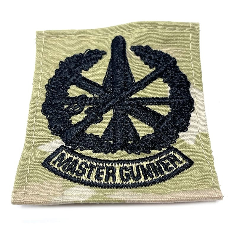 Patch with star design and 'Master Gunner' text on a green background