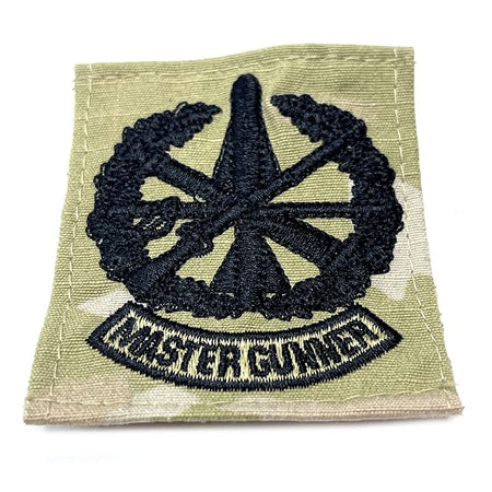 Patch with star design and 'Master Gunner' text on a green background