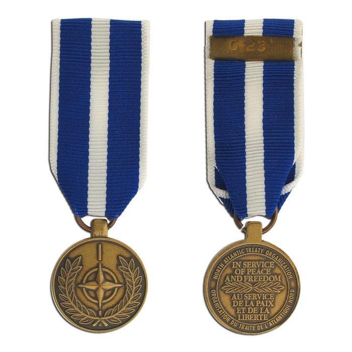 Front and back views of a World War II French Foreign Legion Medal de Guerre 1939-1945, featuring a blue and white striped ribbon and a bronze-toned medallion.