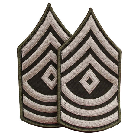 Two embroidered military rank insignia patches with chevron and diamond patterns in olive drab, black, and off-white, shown on a plain white background.