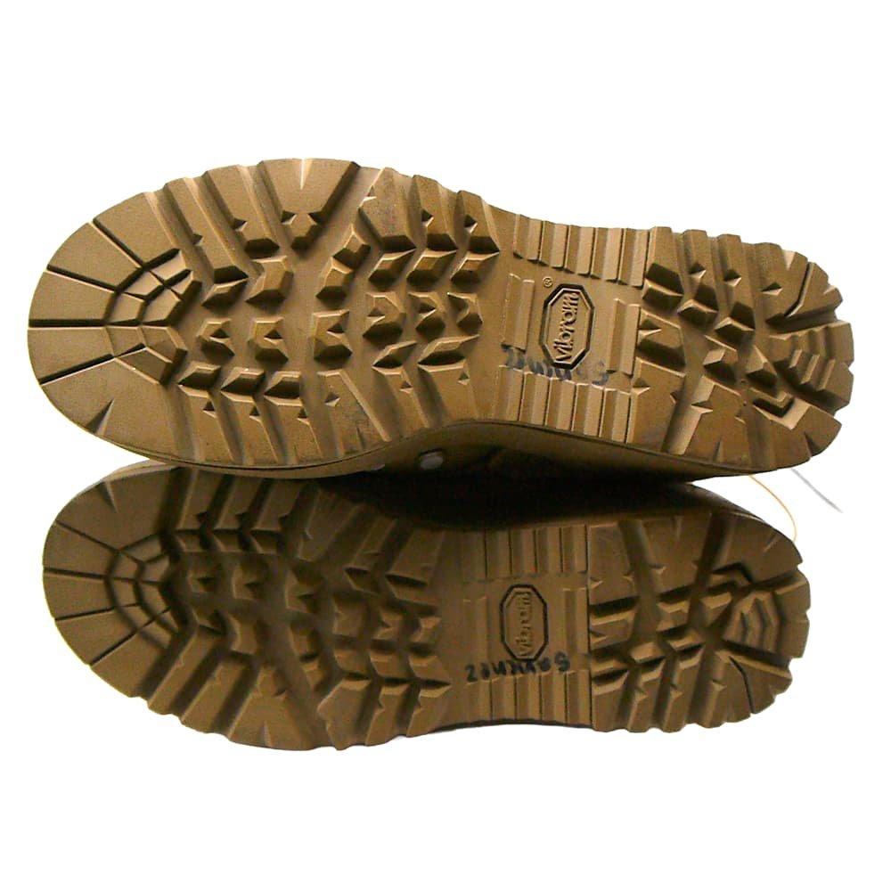 A pair of rugged brown rubber shoe soles shown from above, stacked vertically on a white background.