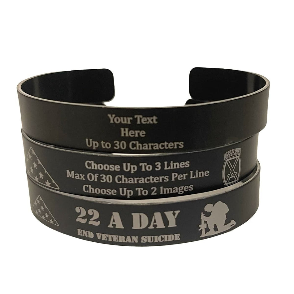 Three stacked black military memorial bracelets on a white background, with the top bracelet showing customizable text placeholders