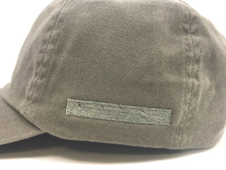 Gray cap with a rectangular patch on a white background
