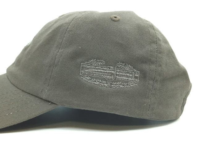 An olive green cotton baseball cap with a tonal embroidered logo on the front, photographed against a white background.