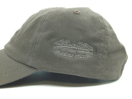 An olive green cotton baseball cap with a tonal embroidered logo on the front, photographed against a white background.