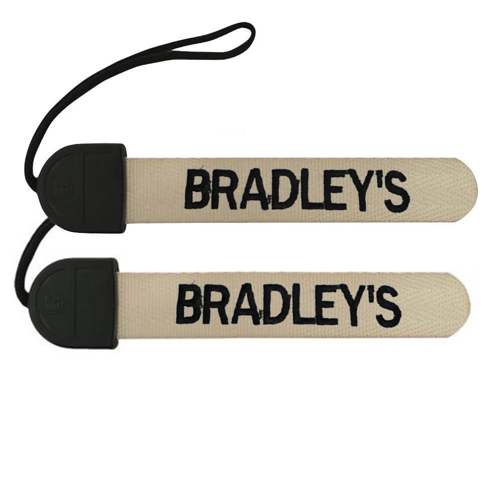 Two beige straps with 'BRADLEY'S' printed on them, attached to black plastic ends.