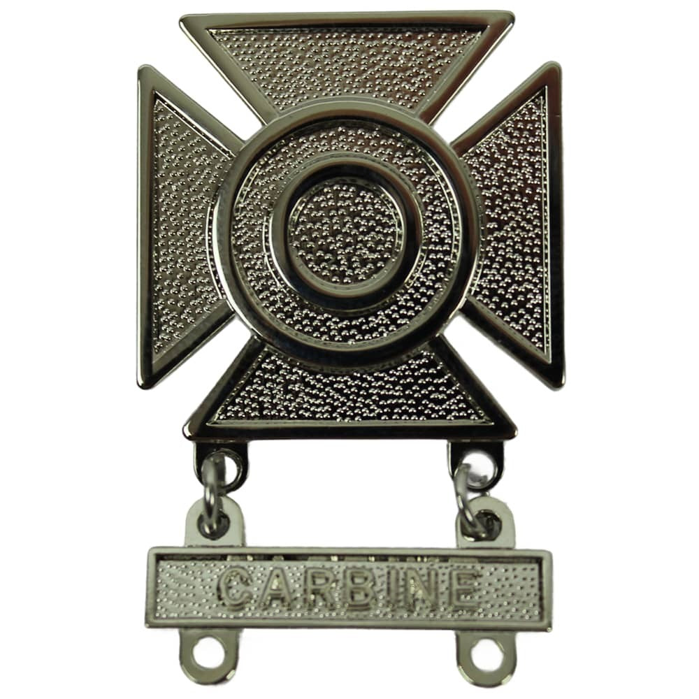 Metallic badge with a cross design and 'CARBIDE' engraving on a white background