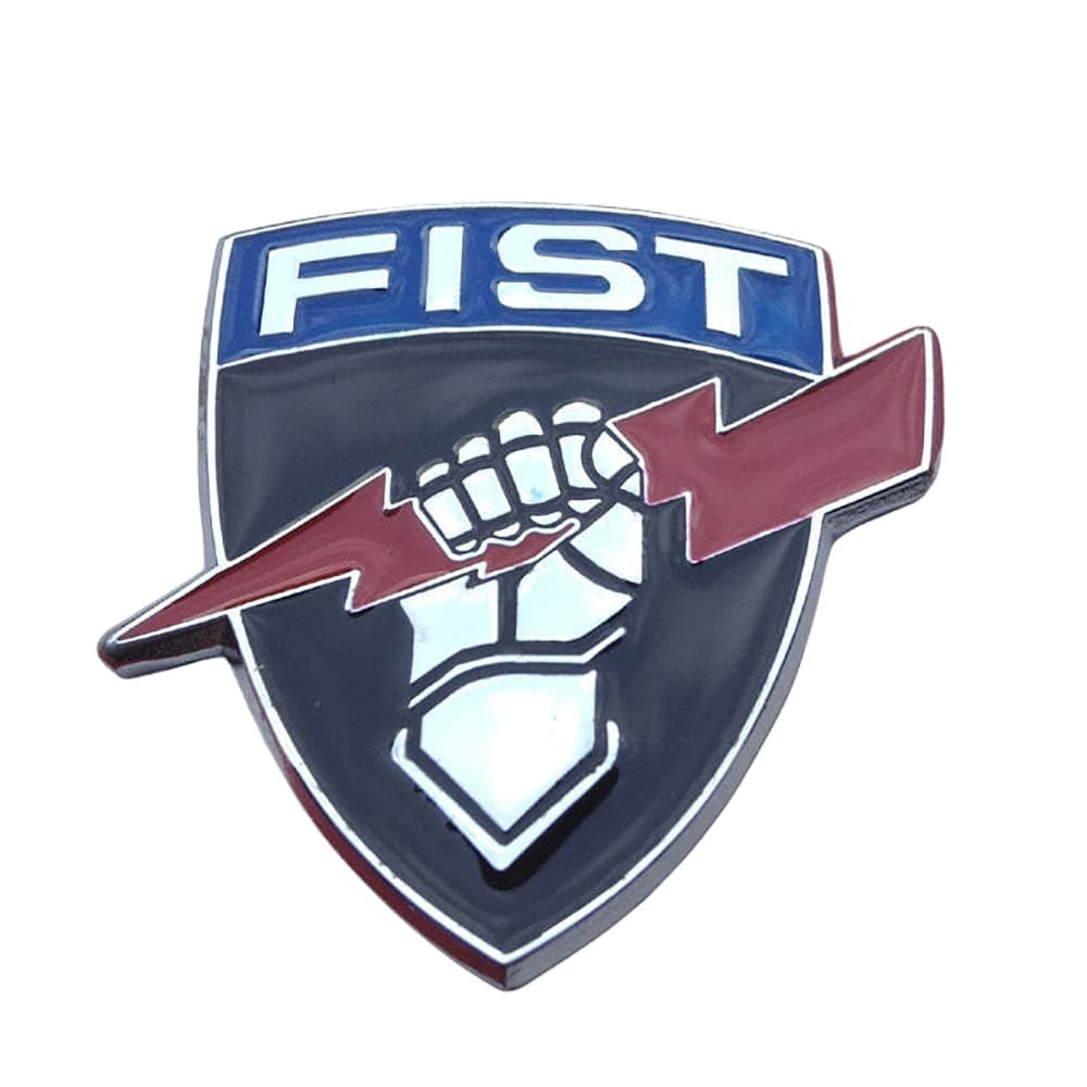 A shield-shaped enamel pin featuring the word 'FIST' in white on a blue background at the top, with a raised fist and red lightning bolt across a dark navy shield below.
