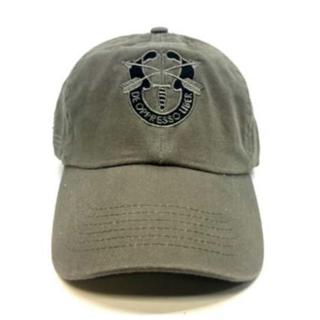 An olive drab baseball cap featuring a dark embroidered emblem on the front with crossed rifles and the text 'DE OPPRESSO LIBER'.